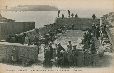 Women washing laundry in the port at Louen by French Photographer